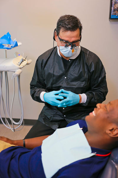 Dr. Jimmy Gardiner with a patient at Singing River Dentistry in Tuscumbia, AL