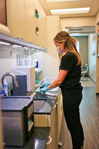Our dental assistant working in a lab at Singing River Dentistry in Tuscumbia, AL.