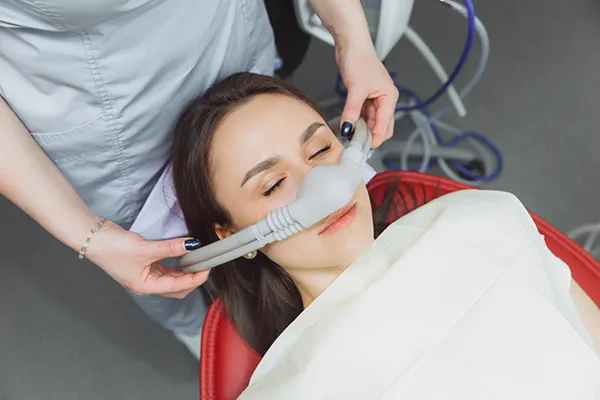  patient receiving nitrous oxide during a dental procedure